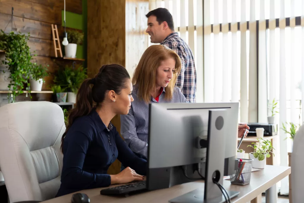 In busy company office workers are having a full day. Cozy start-up office